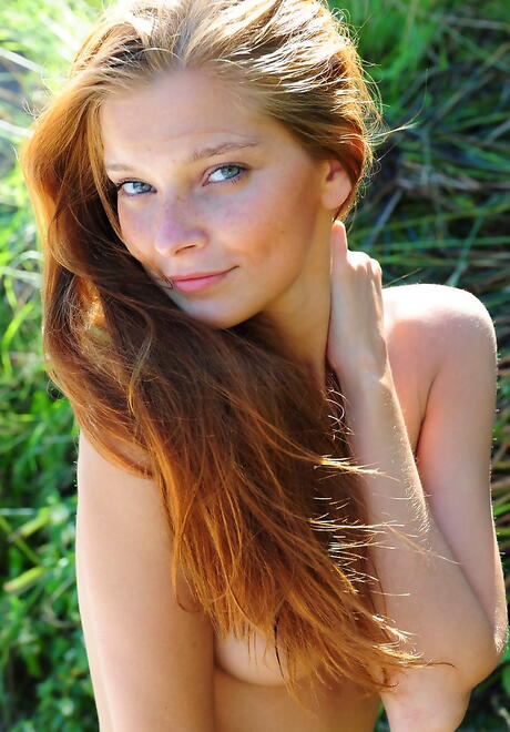 Glamorous redhead hottie Indiana A shows big titties and bald pussy outdoor