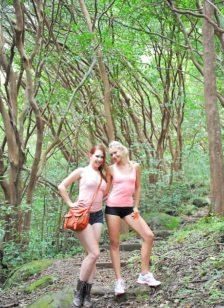 Gracile girls Lena Nicole and Melody Jordan in shorts pleasing each other outdoor